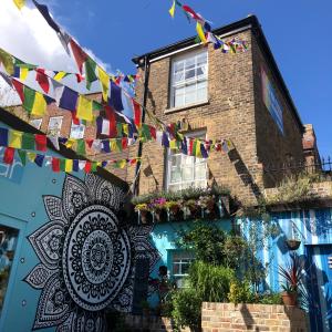 a building with prayer flags and a house at The Beetroot in Margate