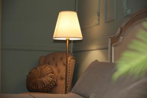 Postel nebo postele na pokoji v ubytování LE ZAGARE B&B - Ares + 2 fotografie