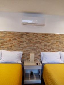 Postel nebo postele na pokoji v ubytování HOTEL COLIBRÍ