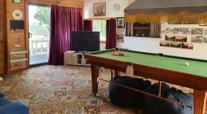 A pool table at Cobden Crest Cottages
