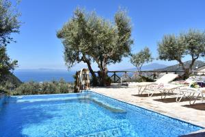 a swimming pool with a view of the ocean at Casa Mazzola in Sant'Agnello