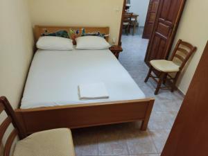 A bed or beds in a room at Stone House