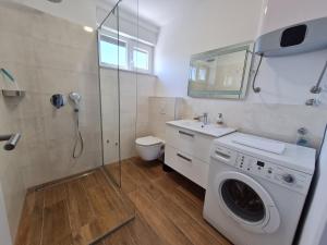 Kúpeľňa v ubytovaní Apartmani Adria