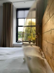 Postel nebo postele na pokoji v ubytování De Prins