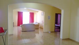 a living room with a white couch and a window at Apartment Barski in Bar