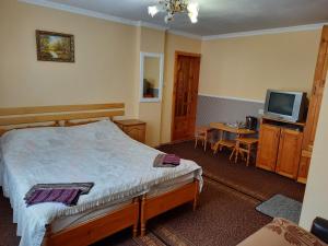 Ένα ή περισσότερα κρεβάτια σε δωμάτιο στο Zelenyj Gaj