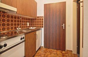 Kuchyň nebo kuchyňský kout v ubytování Serviced Apartments Wallis
