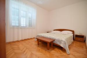 Posteľ alebo postele v izbe v ubytovaní Apartmani Badurina - Crnika