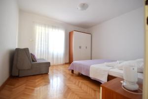 Posteľ alebo postele v izbe v ubytovaní Apartmani Badurina - Crnika