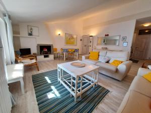a living room with a couch and a table at La Finestra sul Lago in Domaso