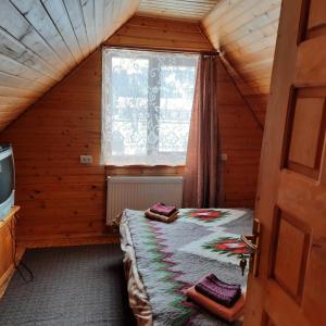 Ένα ή περισσότερα κρεβάτια σε δωμάτιο στο Zelenyj Gaj