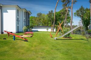 Ein Garten an der Unterkunft Appartement "Karat" mit Penthouseflair - Oase am Haff