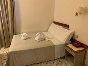 A bed or beds in a room at Hotel Villa Tiziana