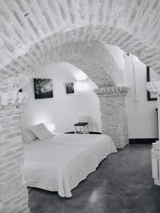Postel nebo postele na pokoji v ubytování Casa rural cueva El Nido + 37 fotografií