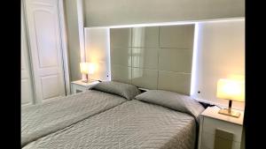 A bed or beds in a room at MI CAPRICHO 2F BEACHFRONT- Apartment with sea view - Costa del Sol
