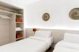 Ein Bett oder Betten in einem Zimmer der Unterkunft Apartamentos Venecia