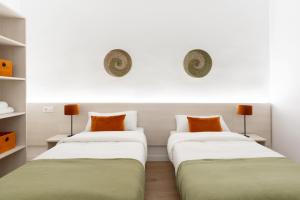 Ein Bett oder Betten in einem Zimmer der Unterkunft Apartamentos Venecia