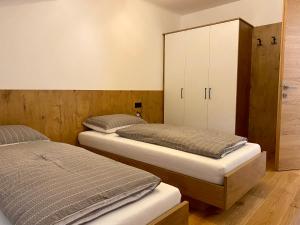 En eller flere senge i et værelse på Der Söllhof