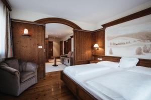 Łóżko lub łóżka w pokoju w obiekcie Kristallhotel Corona-Krone