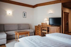 Łóżko lub łóżka w pokoju w obiekcie Kristallhotel Corona-Krone
