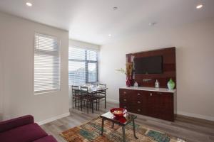 a living room with a couch and a table at The Most Beautiful Bay View from 1 Bedroom Apt in San Diego +33 photos