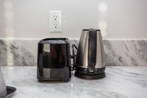 two toasters sitting on top of a kitchen counter at The Most Beautiful Bay View from 1 Bedroom Apt in San Diego