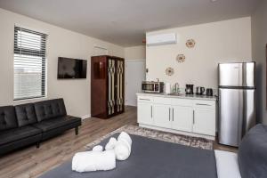 a living room with a couch and a kitchen at Studio with Beautiful View next to Downtown in San Diego