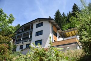 a white building with trees in front of it at Haus Hoen in Untertweng