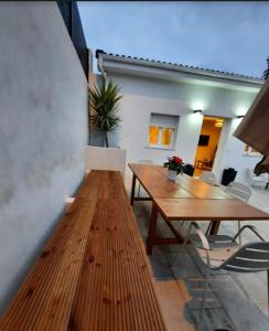 a dining room with a wooden table and chairs at Vivienda Vacacional LA PERILLANA in Avilés