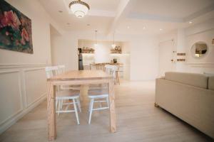 a kitchen and dining room with a table and chairs at Recoleta White Home in Buenos Aires