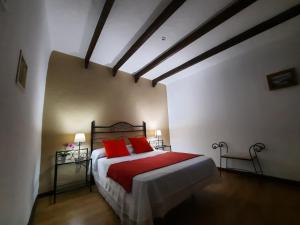 Кровать или кровати в номере Casa Cueva Villa Aday