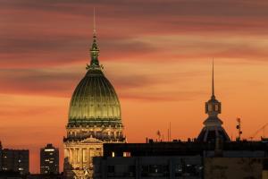 a view of the dome of a building at sunset at Up Congreso Hotel in Buenos Aires