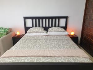 Łóżko lub łóżka w pokoju w obiekcie Madre Tierra Apartment