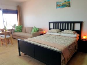 Łóżko lub łóżka w pokoju w obiekcie Madre Tierra Apartment