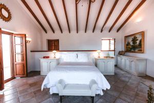A bed or beds in a room at La Esperanza Granada Luxury Hacienda & Private Villa