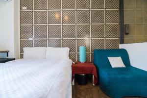 Cama o camas de una habitación en 馬公港精品旅宿包棟烤肉附設租車