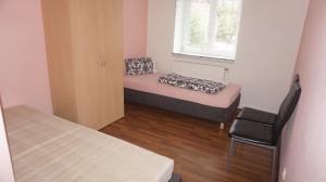 Tempat tidur dalam kamar di Hostel Falkenstein