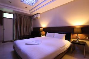 Кровать или кровати в номере HTel Resort