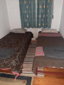 Un pat sau paturi într-o cameră la EFTHYMIOS Φθηνη και ησυχη διαμονη
