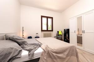 A bed or beds in a room at Casa Vacanze Pantinta - Nel cuore del Salento a 8 minuti dal Mare