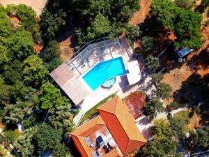 an overhead view of a house with a swimming pool at Golden Sand in Marathokampos