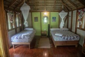 Postel nebo postele na pokoji v ubytování Aventura Rincon Ecolodge