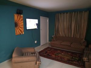 Posezení v ubytování The Teal House