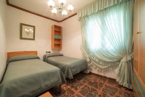 Katil atau katil-katil dalam bilik di TurJalon - Apartamentos