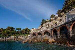a bridge over the water next to a river at Excelsior Palace Portofino Coast in Rapallo