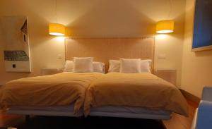 Postel nebo postele na pokoji v ubytování Hotel Ceres