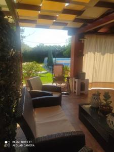 Posedenie v ubytovaní La stanza delle Muse in Villa con Piscina