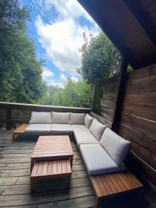 a porch with couches and a table on a deck at פסגת מתת Pisgat mattat in Mattat