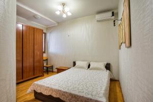מיטה או מיטות בחדר ב-Apartments Familiya Elitе