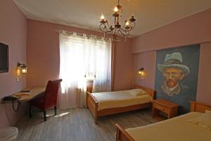 Postel nebo postele na pokoji v ubytování Hotel Champ Alsace